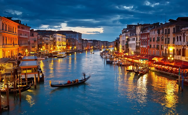 Gondolas in the Grand Canal at sunset in Venice, Italy