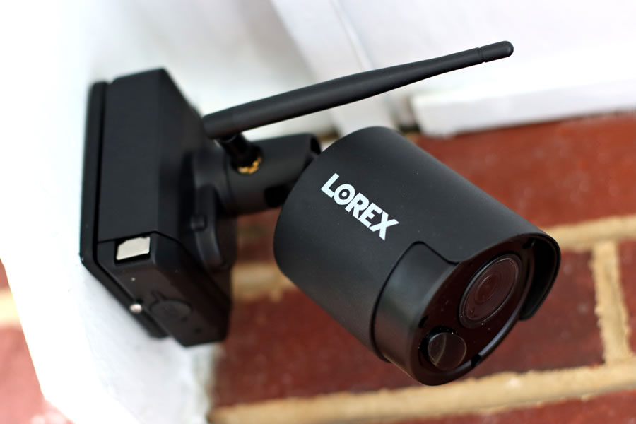 The Lorex wireless weatherproof camera system installed against a brick home