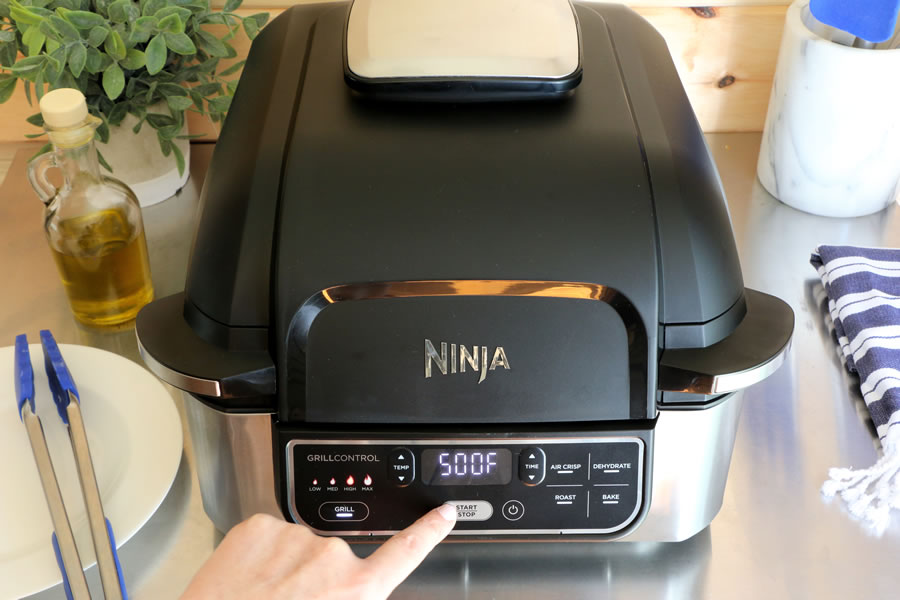 The Ninja Foodi Grill preheating on high 