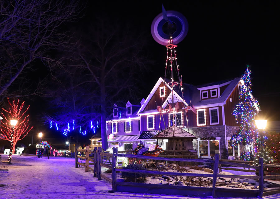 A windmill at night in Peddler's Village lit up for the holidays