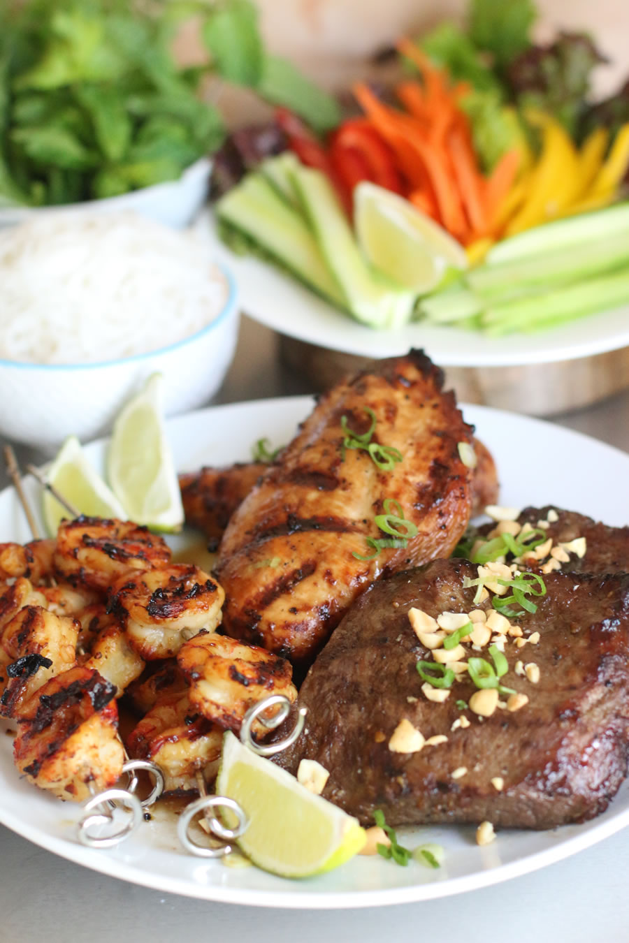 Vietnamese mixed platter with cucumber, peppers, carrots and herbs made with the Ninja Foodi Grill