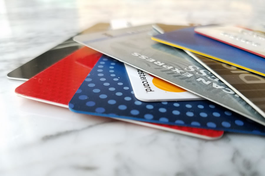 a stack of different credit cards
