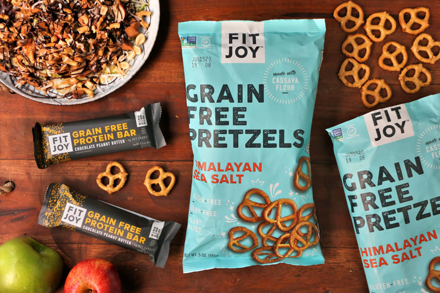 a plate of apple nachos made with grain-free FitJoy pretzels and FitJoy Grain Free Protein Bar