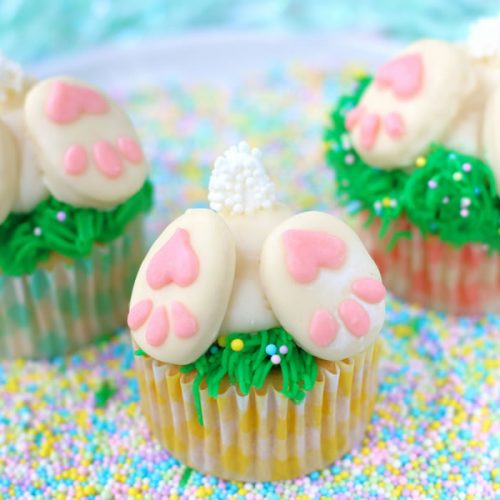 three bunny butt cupcakes on sprinkles