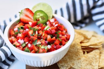 Strawberry Jalapeño Salsa in a white bowl with tortilla chips