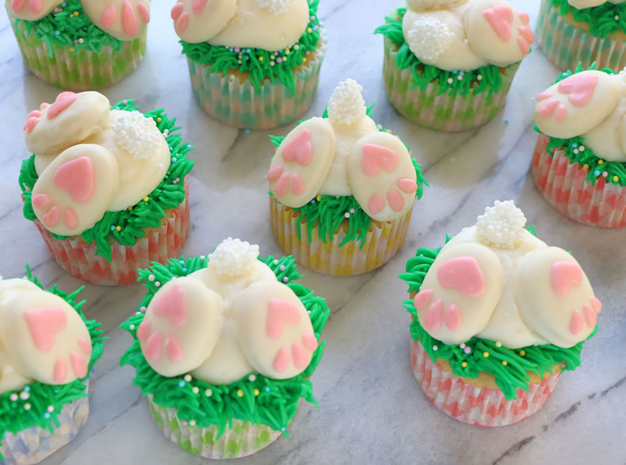 Bunny Butt Cupcakes with grass on marble