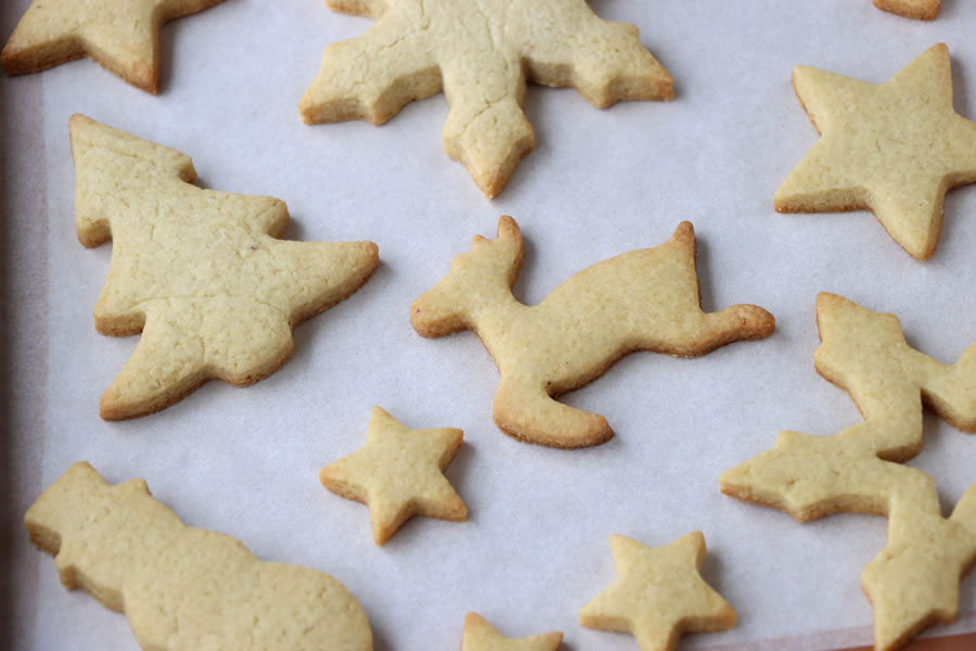 sugar free sugar cookies with holiday shapes like stars reindeer christmas tree and snowman