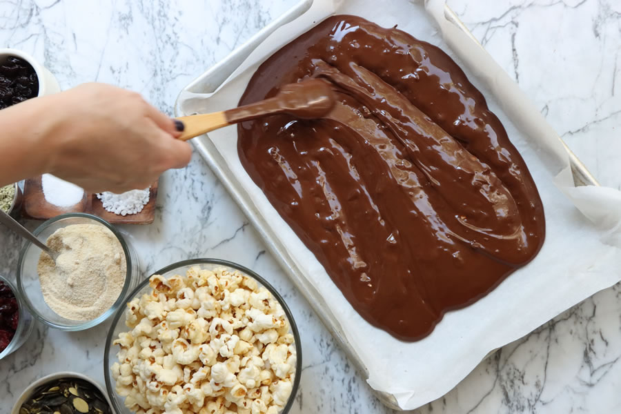 making Fall Popcorn Bark with melted Chocolate | BetterLiving