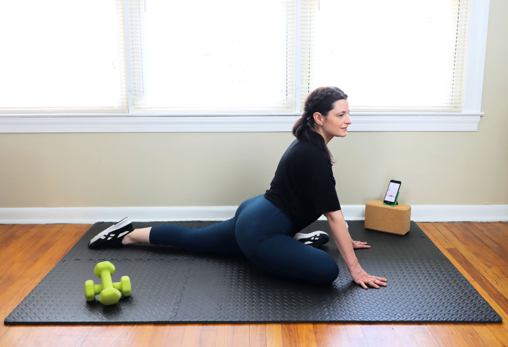 A woman working out at home with the Future app