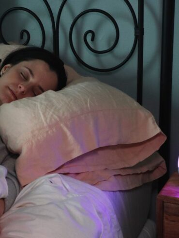 A woman sleeping soundly in bed
