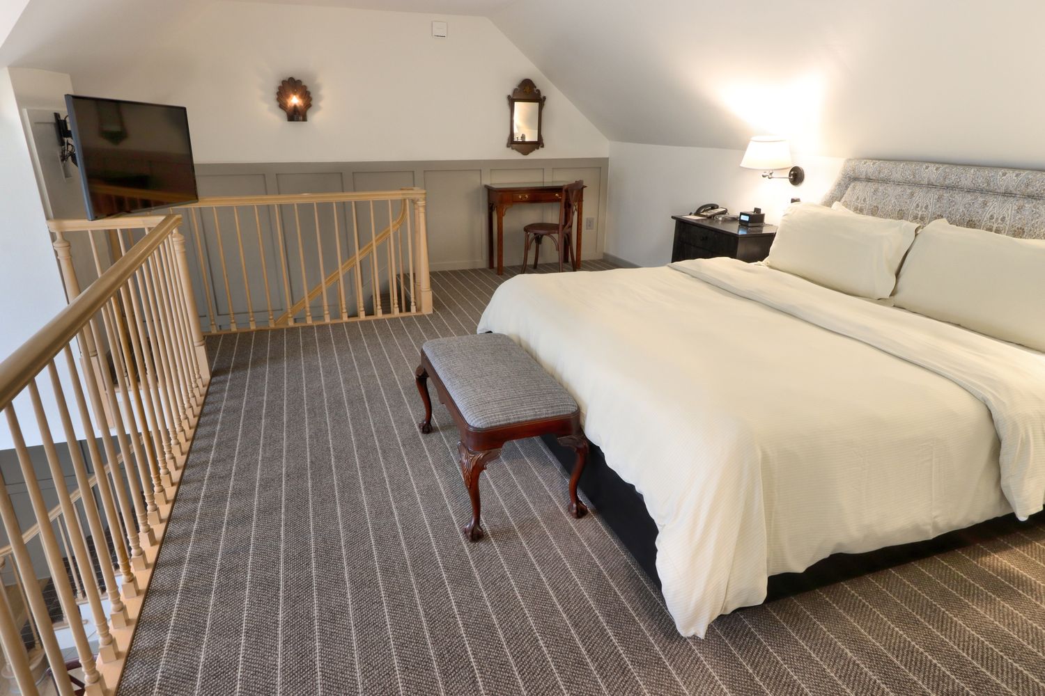 The upper level and King bed in Room 110 at The Golden Plough Inn.