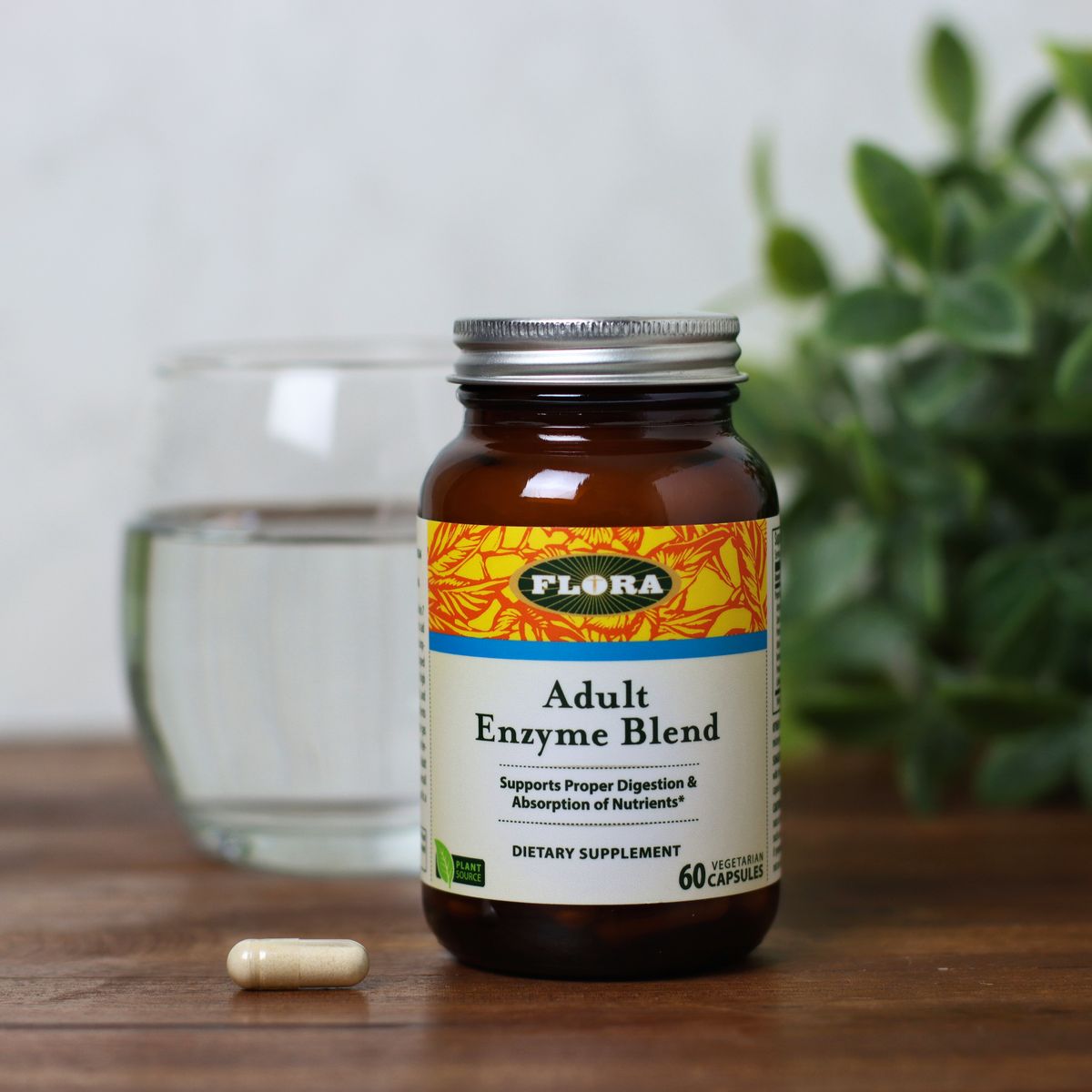 A bottle and capsule of Advanced Adult Enzyme Blend digestive enzymes from Flora