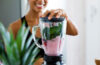 A woman makes a healthy smoothie