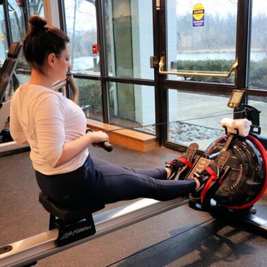 Heather from Better Living on a rowing machine at the fitness center at the Merriweather Lakehouse Hotel