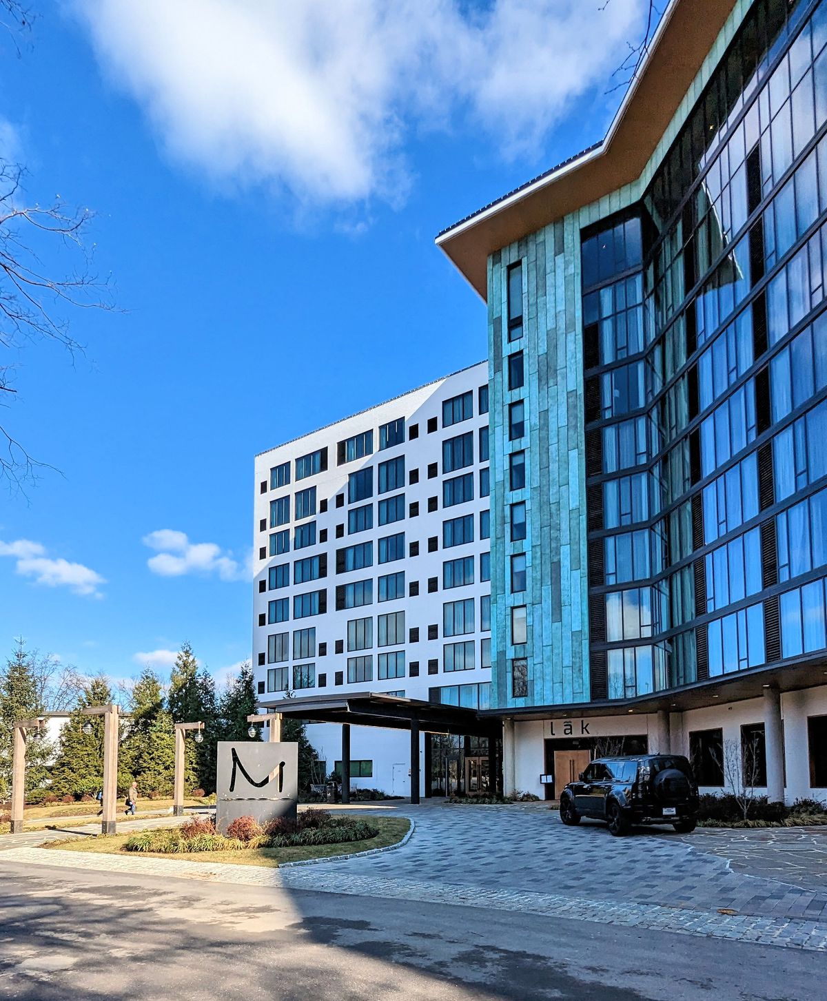 The front exterior of the Merriweather Lakehouse Hotel on a clear and cold winter day. 