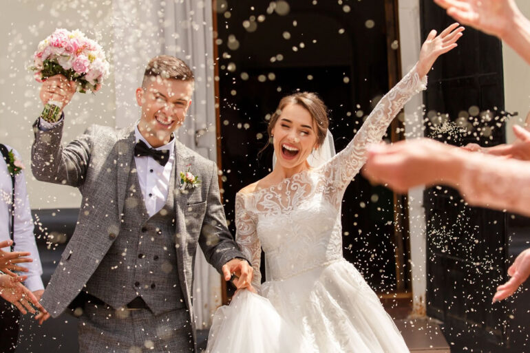 a man and woman getting married and celebrating