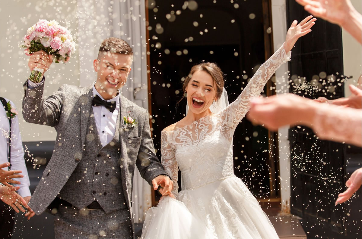 a man and woman getting married and celebrating