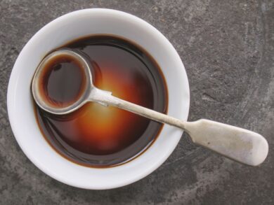 Worcestershire Sauce in a bowl with a spoon.