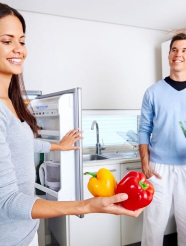 A couple stocks their fridge with healthy foods to help weight loss.
