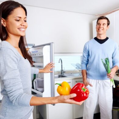 A couple stocks their fridge with healthy foods to help weight loss.