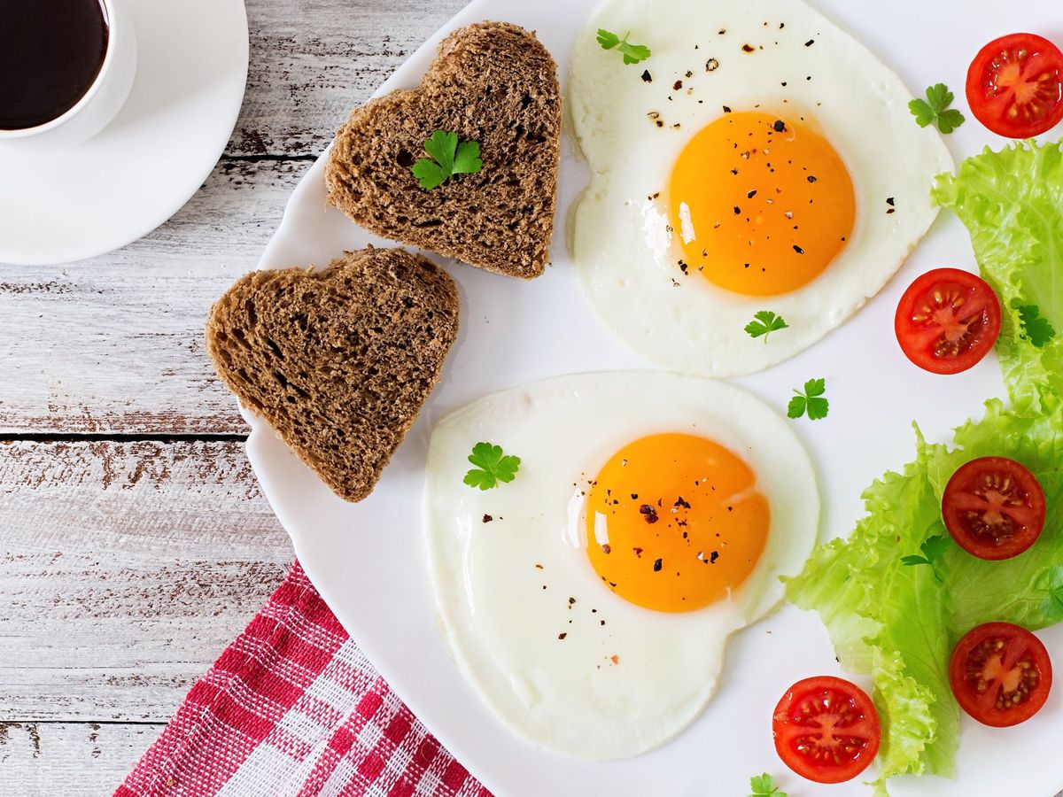 Heart shaped eggs and toast on a plate