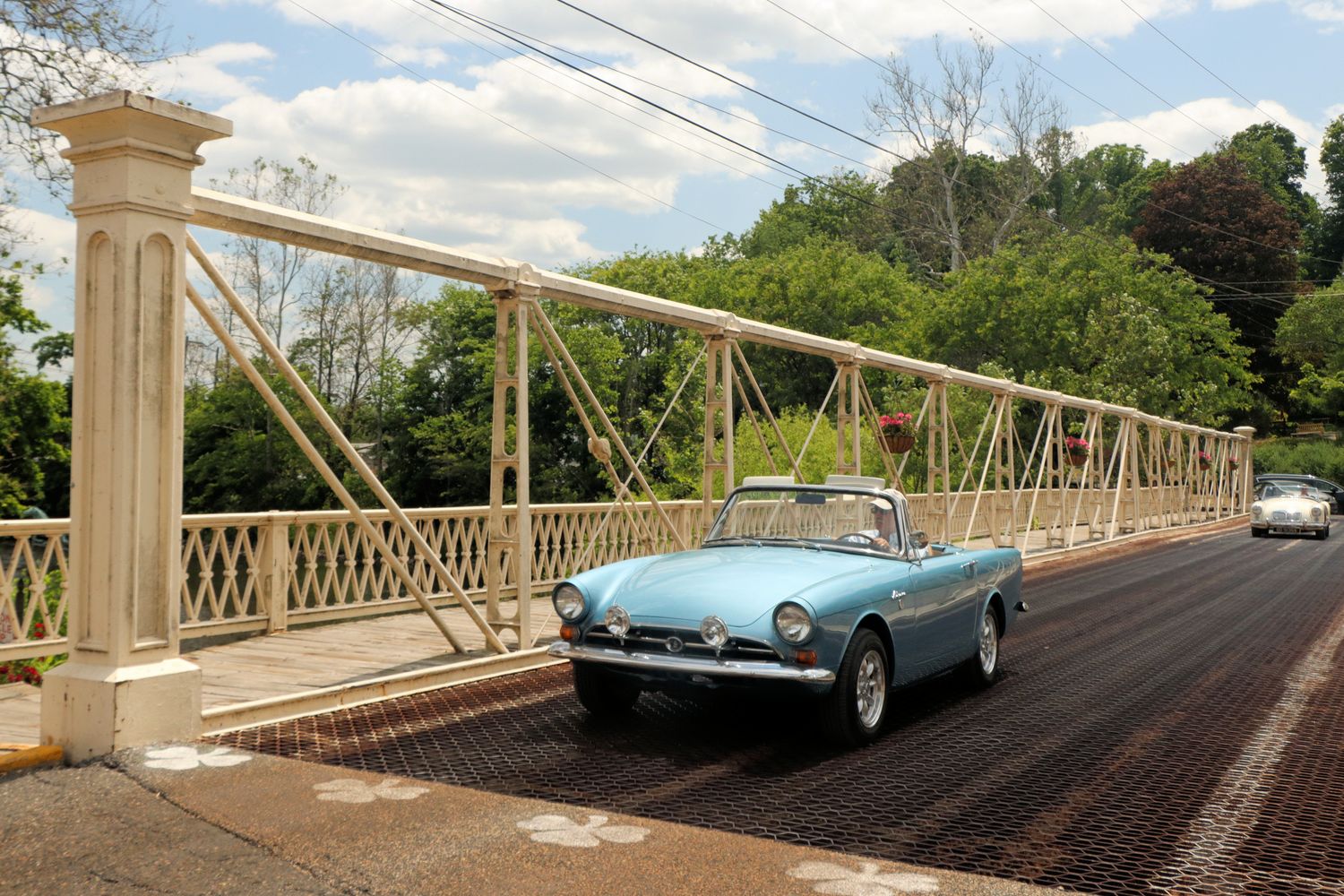 2 antique cars going over Main Street Historic Bridge in Clinton, NJ