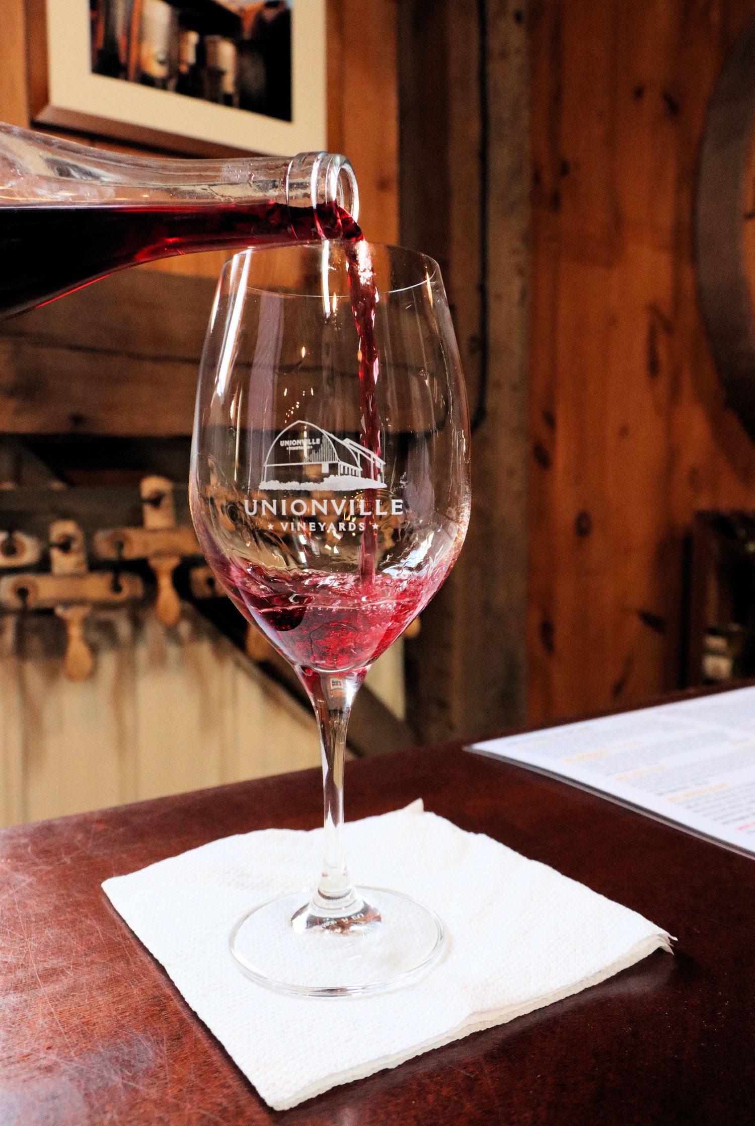 Wine being poured during a guided wine flight at Unionville Vineyards