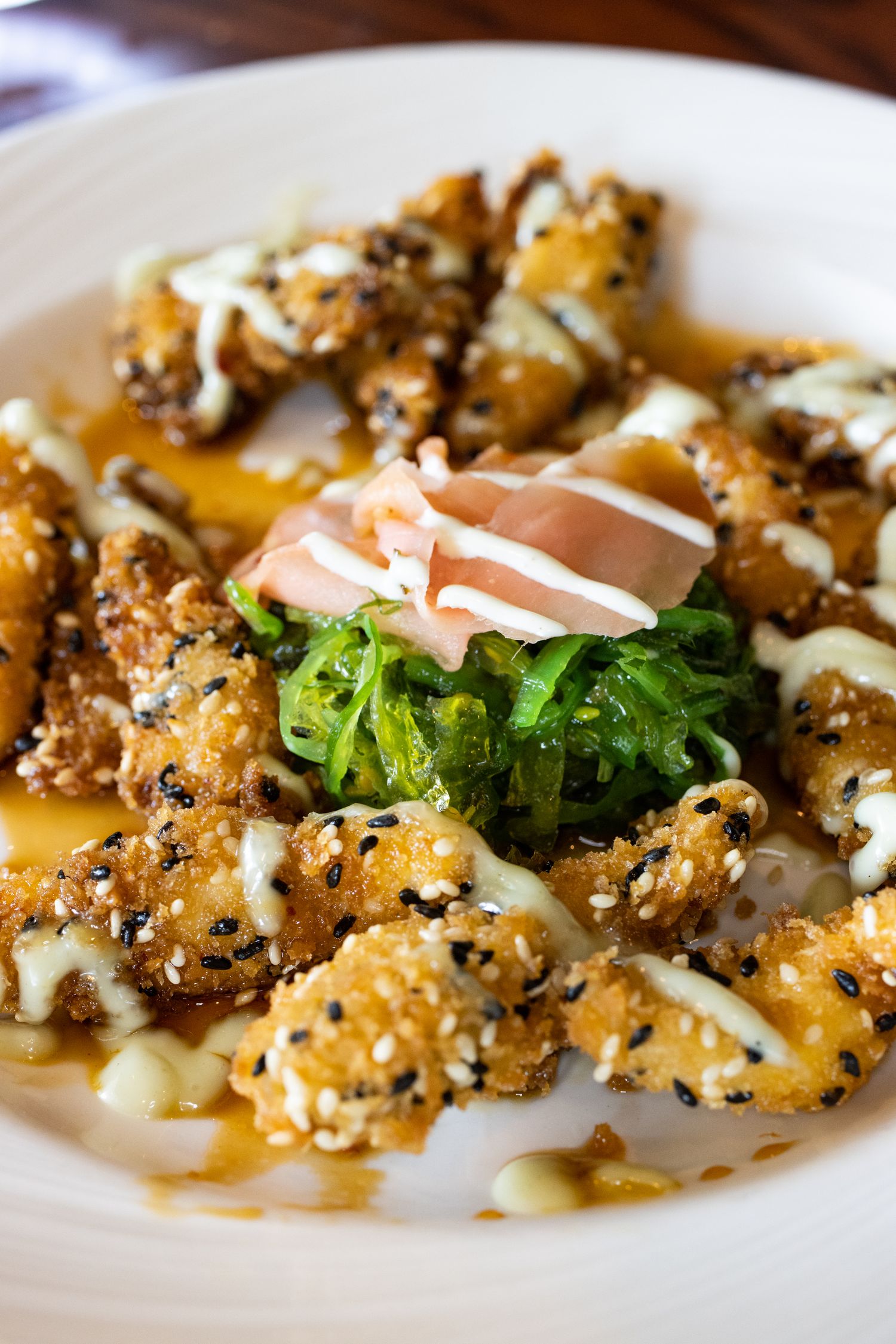 Sesame fried panko Rockfish “Bites” with Hawaiian BBQ, wasabi cream pickled ginger, and seaweed salad