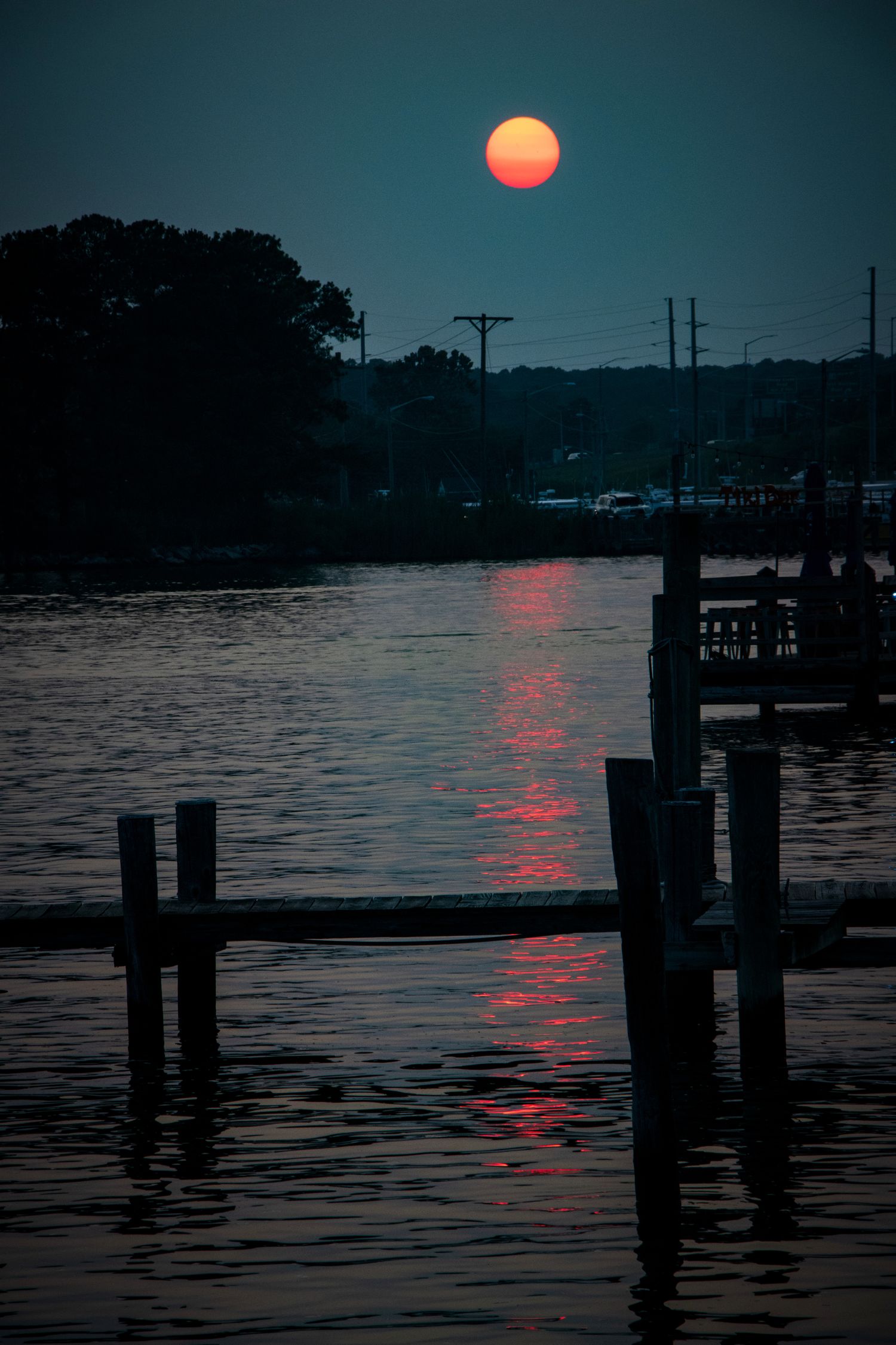 The sunset over the shimmering water from the docks at Hyatt Place Kent Narrows, MD 