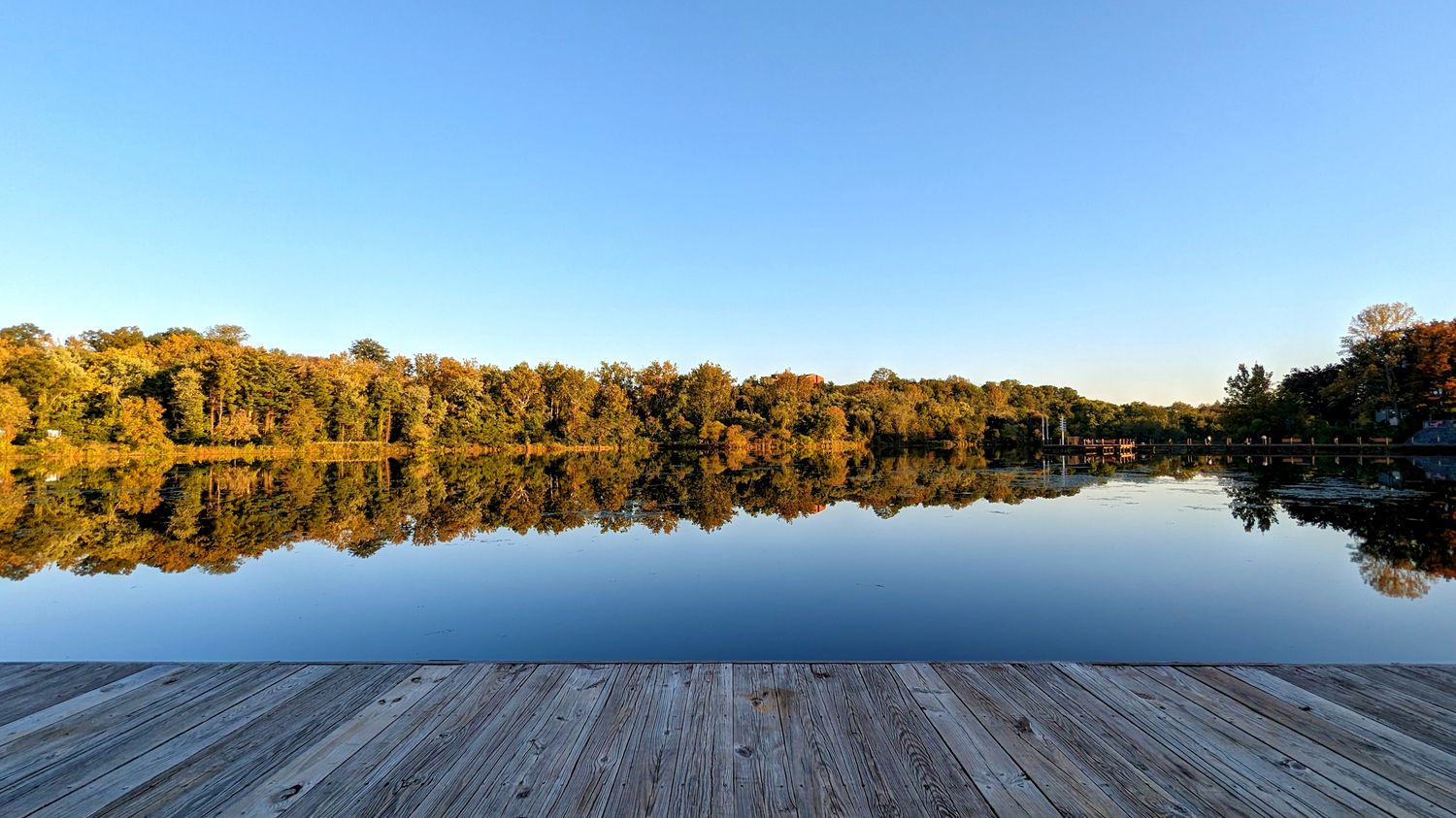 A view of Lake Kittamaqundi from the pier and out to the trees in Columbia, Maryland