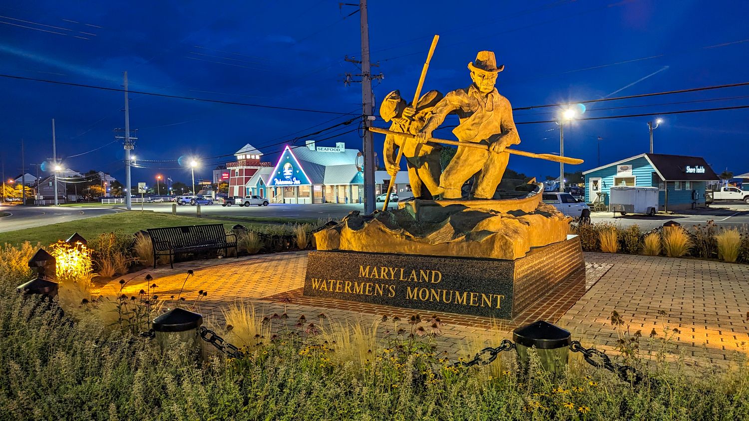 The Maryland Watermen’s Monument at nighttime in Kent Narrows, MD.