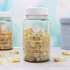 Ritual vitamin bottles with capsules, showing vegan D3, omega-3 DHA, and USP verified certification