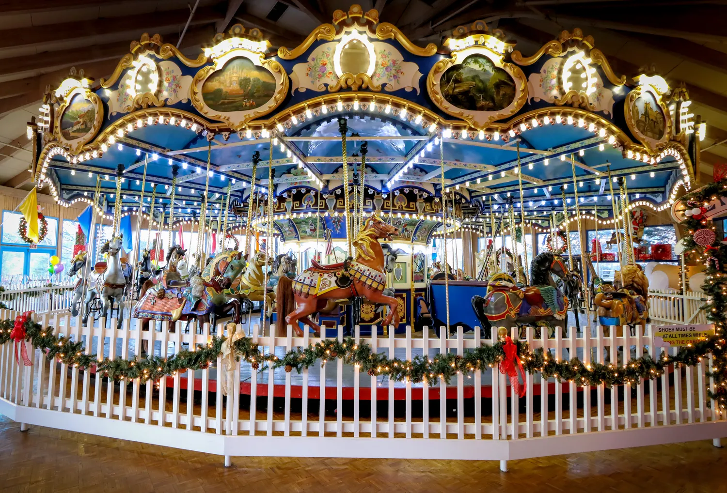 The vintage 1922 carousel in Giggleberry Fair at Peddler's Village is lit up and decorated for Christmas