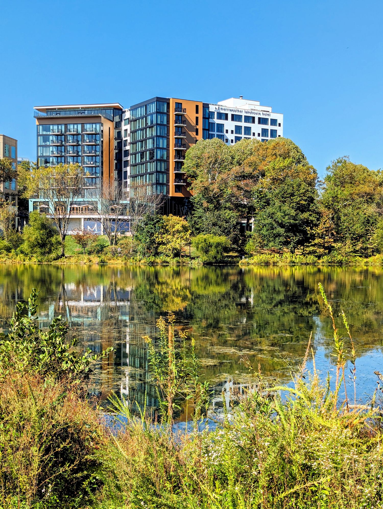 The view of The Merriweather Lakehouse Hotel in Columbia, Maryland from the other side of the lake. 
