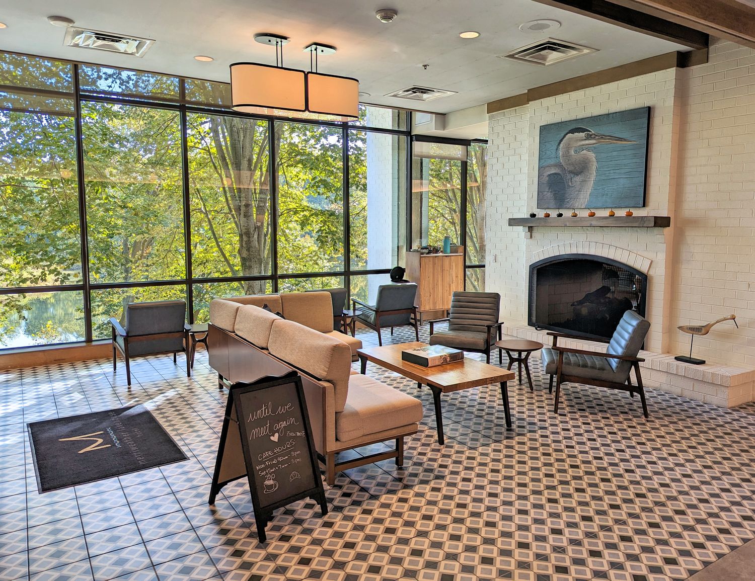 The sitting area and fireplace at the Osprey Cafe at Merriweather Lakehouse Hotel