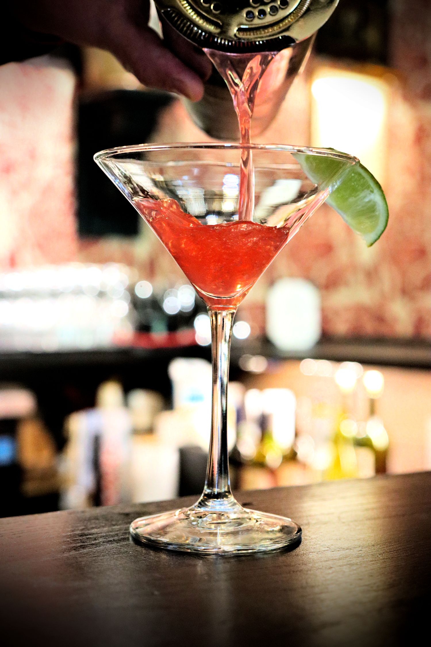 A cosmopolitan being poured at the bar at Red Fox Lounge