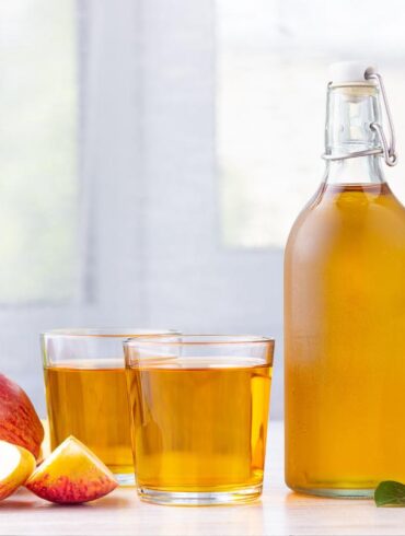 Apple Cider Vinegar on a Kitchen Countertop to be used for cleaning.
