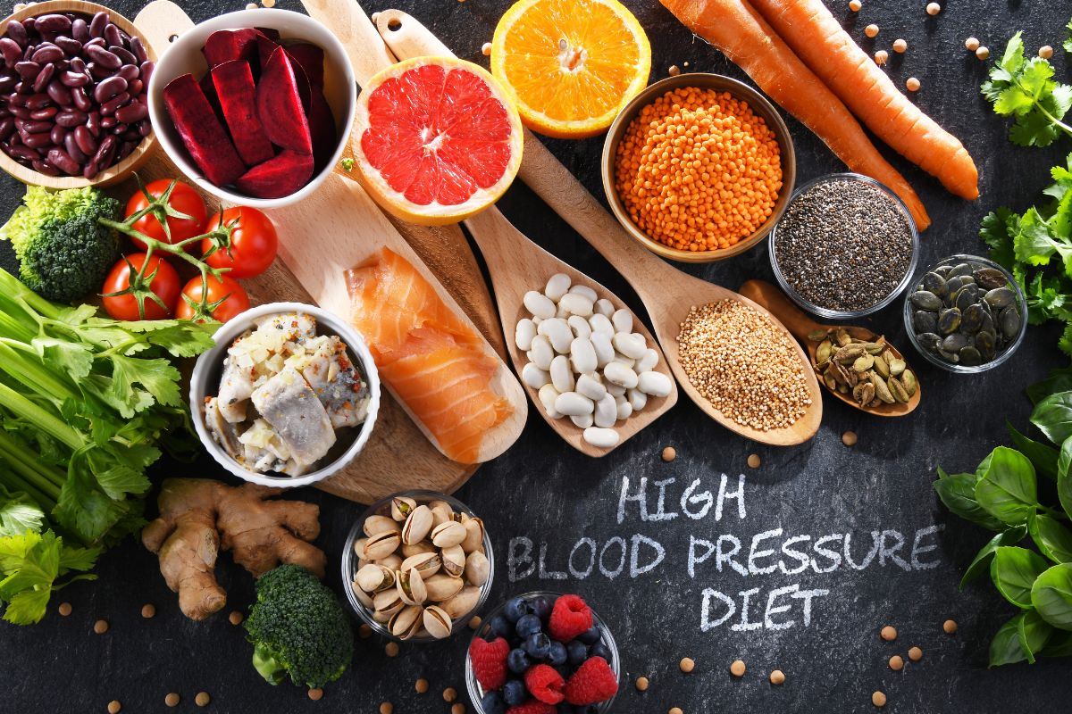 A selection of foods on a table that lower blood pressure with a sign that says 'high blood pressure diet"