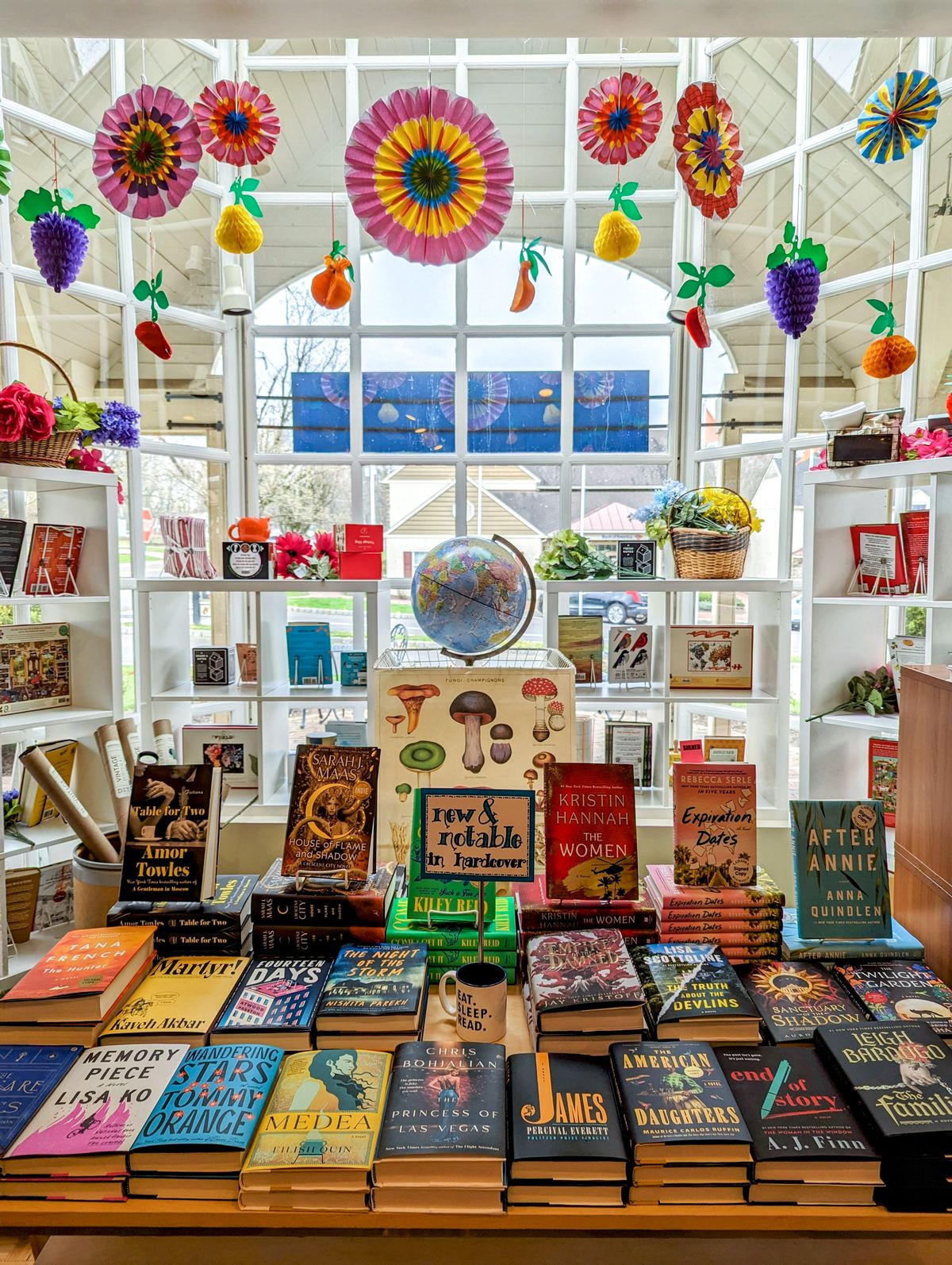 The main display window of Lahaska Bookshop with books and flowers.