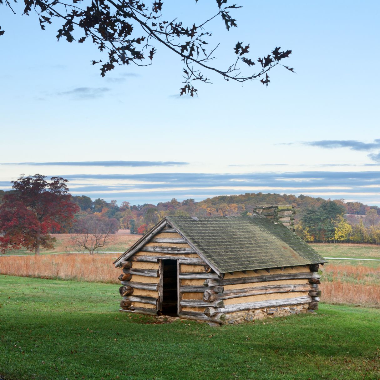 A cabin in an open field at Valley Forge National Historical Park