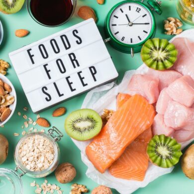 A selection of foods on a table that contain melatonin and a sign reading 'foods for sleep'