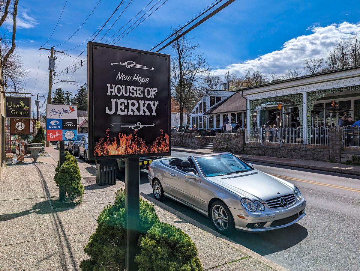 A street view of shops, eateries, and cars in New Hope, PA