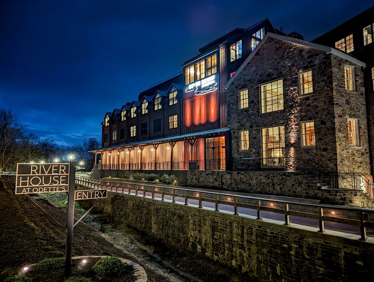 The exterior of River House at night