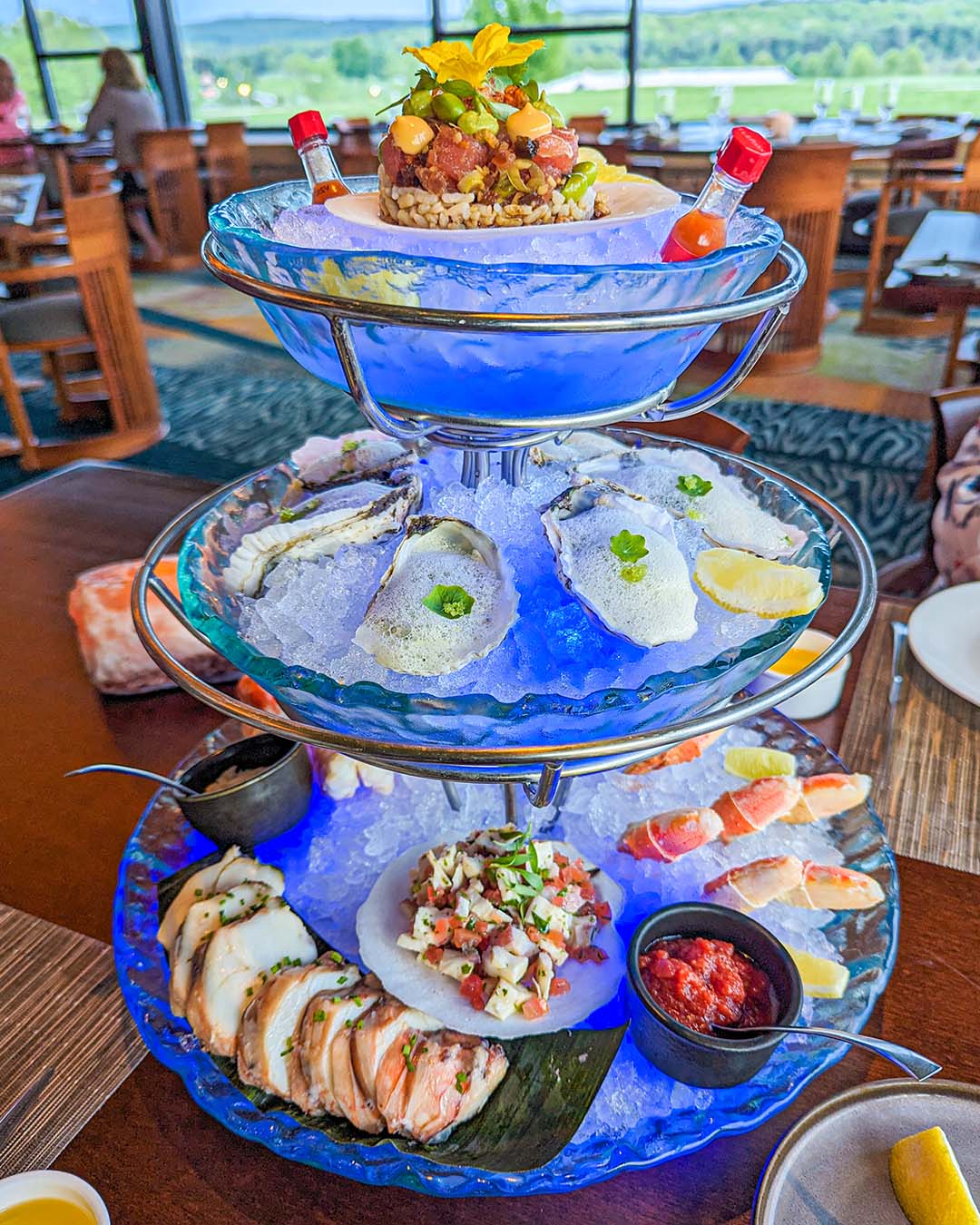 The stunning Seafood Tower at Aqueous. The levels of fresh seafood on beds of ice with led lights.