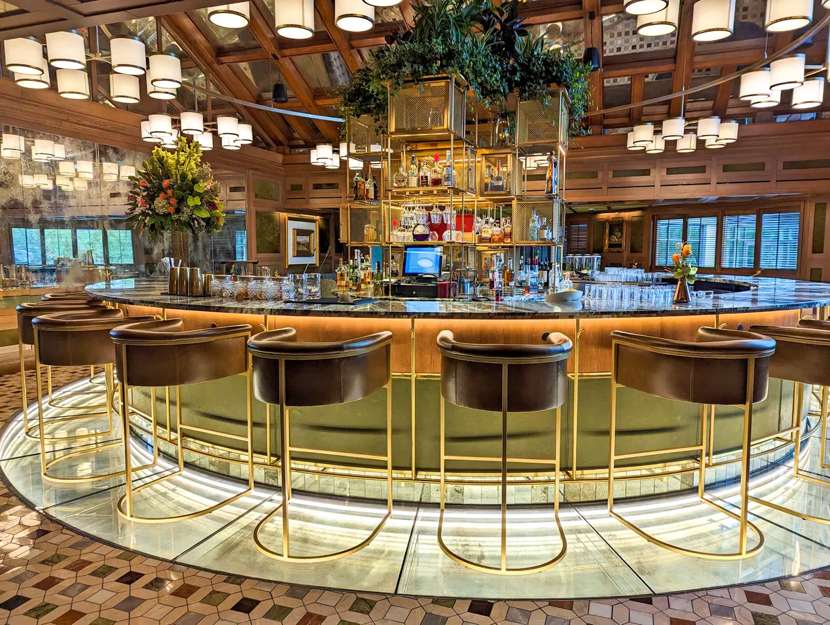 The Circle Bar in The Grand Lodge at Nemacolin. A round bar with chairs around. 