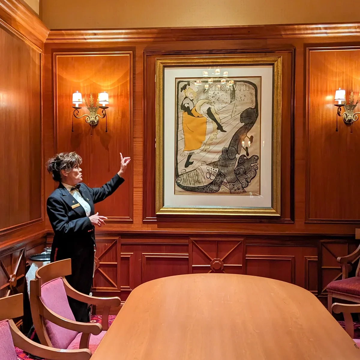 Lisa, the server at Lautrec, conducting an art tour after dinner. 