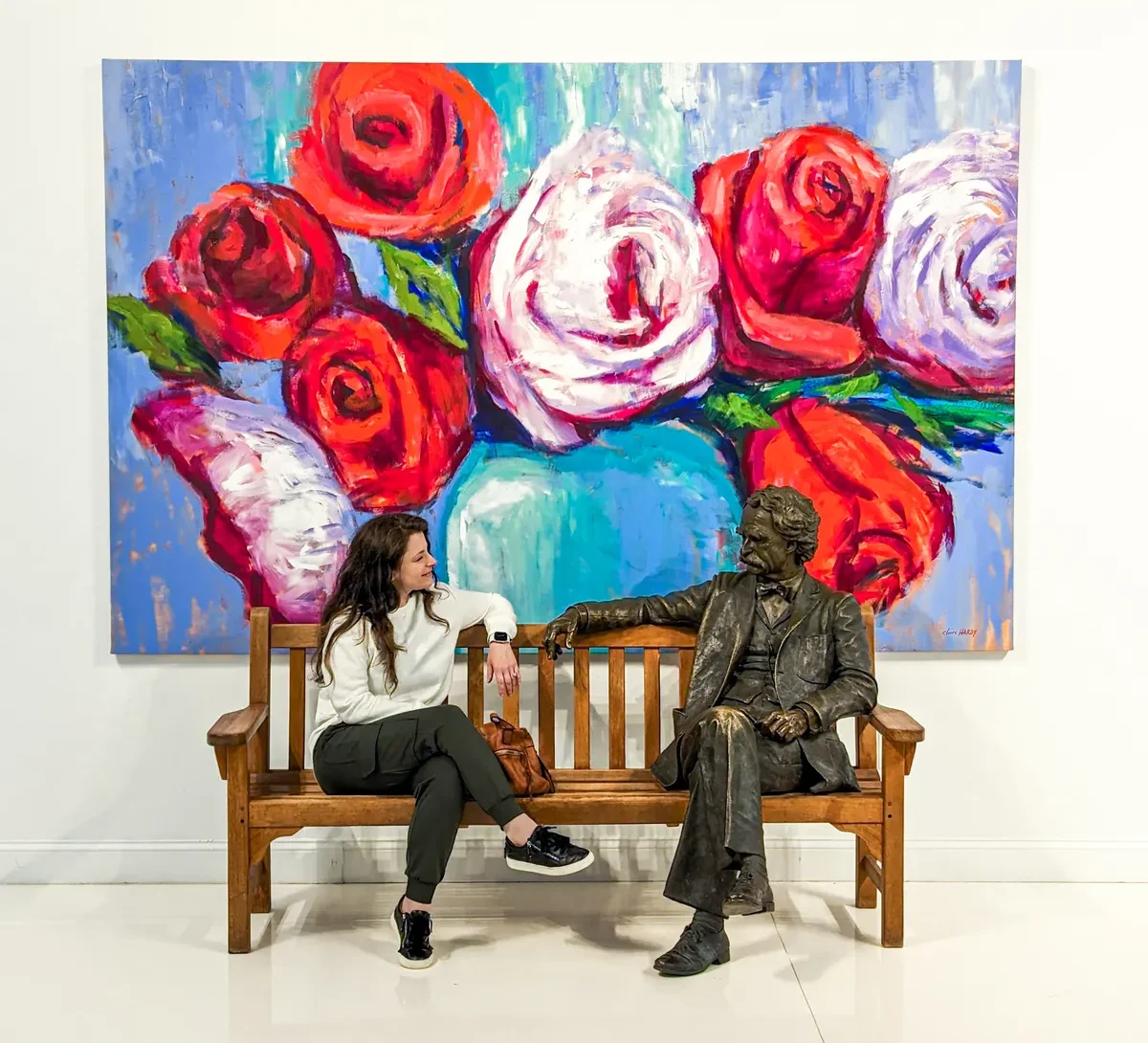 Sit next to a sculpture of Mark Twain and enjoy "Rose Ceremony Bouquet" by Claire Hardy 