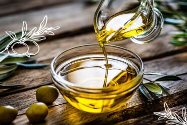 Olive oil pouring into a small clear bowl