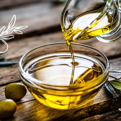 Olive oil pouring into a small clear bowl