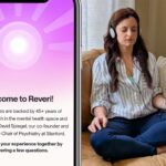 Split image showing a smartphone on the left displaying Reveri's welcome screen with a purple radial sunburst pattern and white center circle. The screen reads "Welcome to Reveri!" followed by text explaining "Our exercises are backed by 45+ years of clinical research in the mental health space and created by Dr. David Spiegel, our co-founder and the Associate Chair of Psychiatry at Stanford." Below states "Let's shape your experience together by answering a few questions." On the right side, a woman sits cross-legged on a tan leather couch wearing a light blue striped shirt and dark jeans. She has brown hair, closed eyes in a meditative state, and wears white headphones connected to a smartphone displaying a pink/orange gradient interface. Her hands rest naturally on her legs, and the setting shows a peaceful living room with natural lighting through sheer curtains and a textured throw pillow visible on the couch.